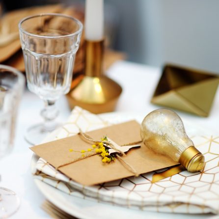 Stylish gold table set with letter